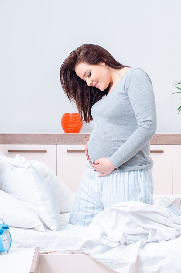 Young Pregnant Woman In The Bedroom Stock Image Image Of Pajamas Expectant 152505399