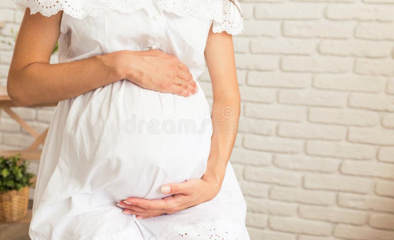 Pregnant Woman Holds Her Hands On Her Swollen Belly Stock Image Image Of Swollen Concept