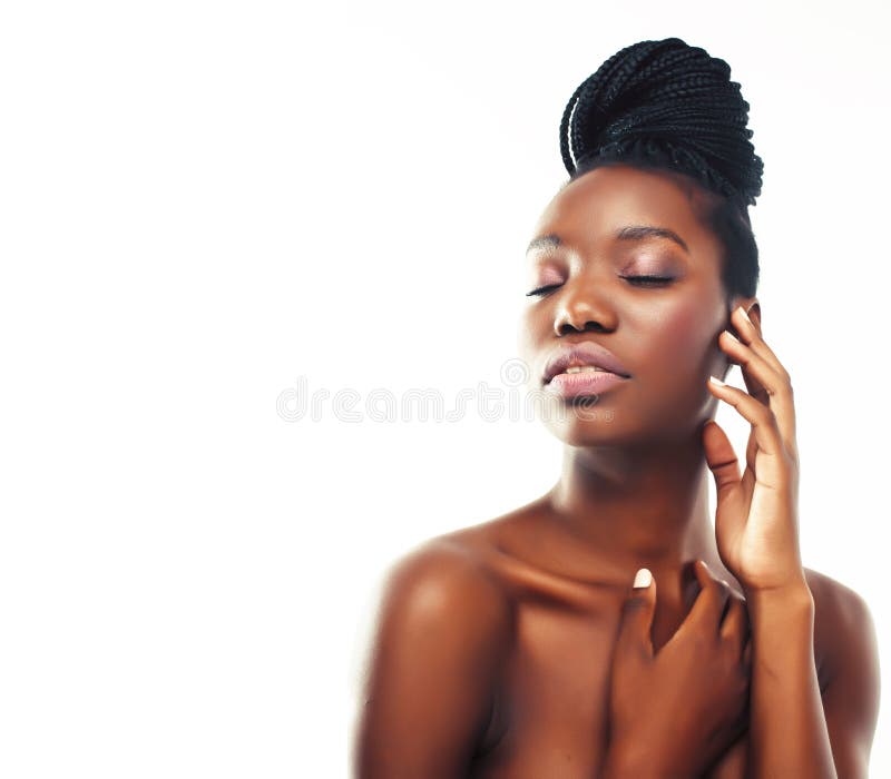 Young pretty african american woman with natural makeup taking care of her skin isolated on white background