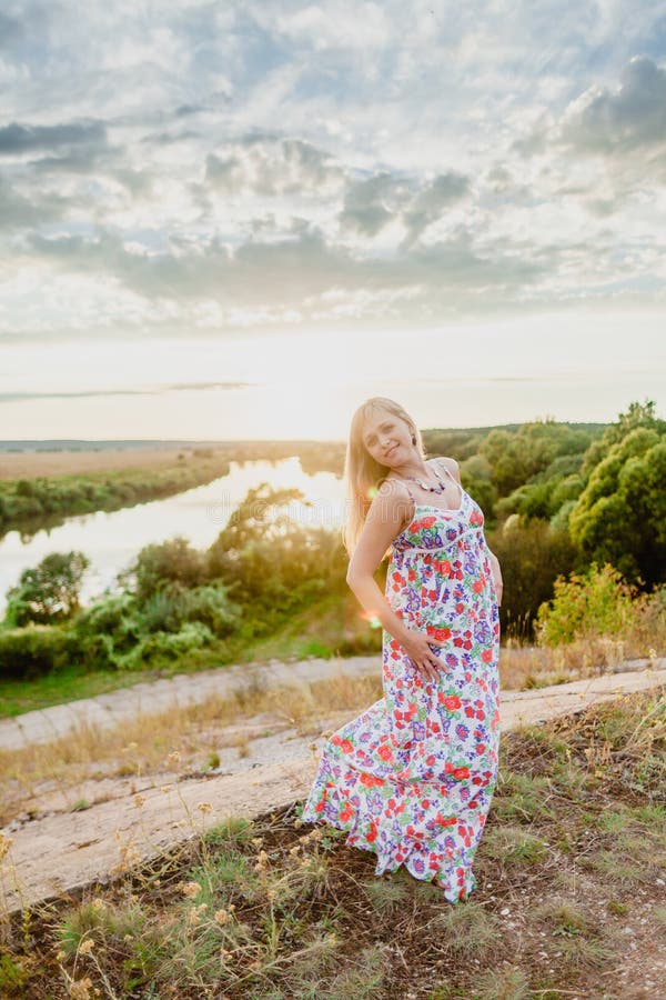 Young pretty blonde and summer sundown stock photography