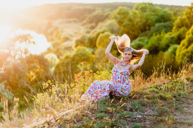 Young pretty blonde and summer sundown royalty free stock photo