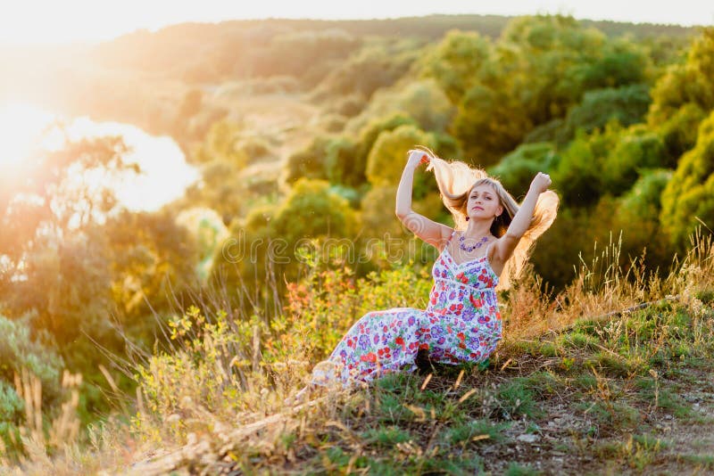 Young pretty blonde and summer sundown royalty free stock photos