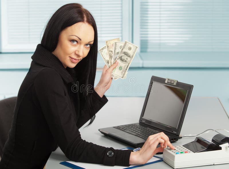 Young pretty business woman with notebook in the office