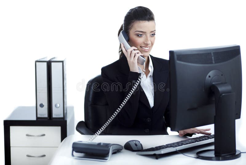 Young and pretty business woman talking over phone