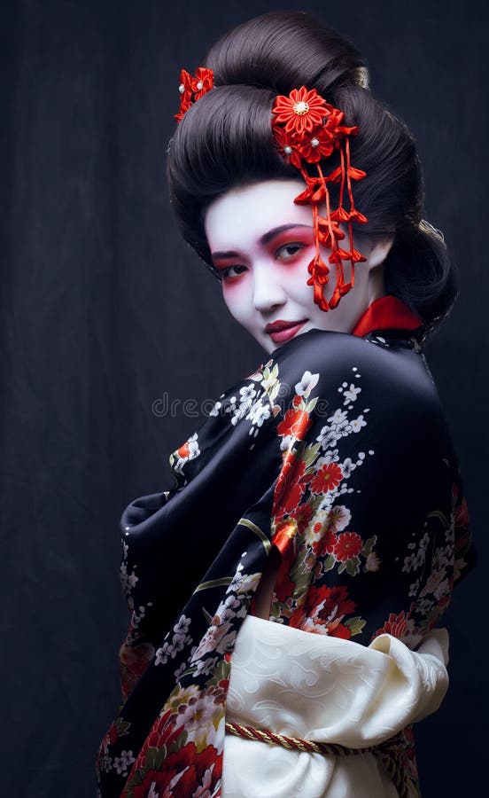 Young pretty geisha in kimono with sakura and