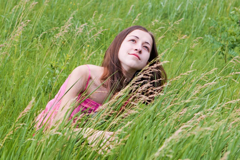 Young pretty girl on grass