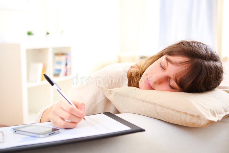 Young pretty girl sleeping while working home royalty free stock photography Young pretty girl sleeping while working home royalty free stock photography