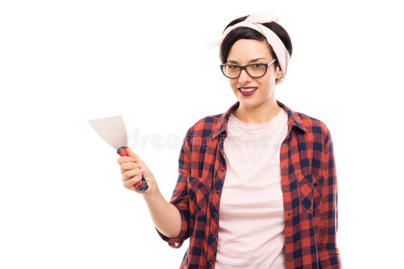 Young pretty pin-up girl holding palette knife stock image Young pretty pin-up girl holding palette knife stock image