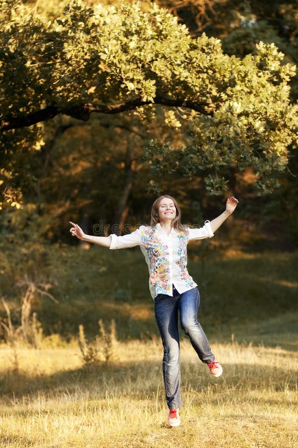 Young pretty woman in the autumn park