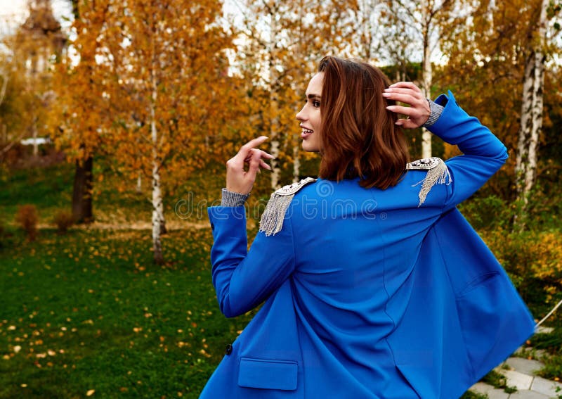 Young Pretty Woman in a Blue Suit Walking and Posing Outdoors Stock ...