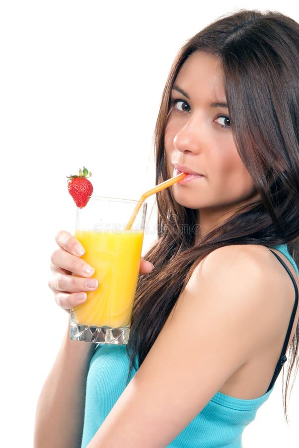 Young pretty woman drinking orange juice cocktail