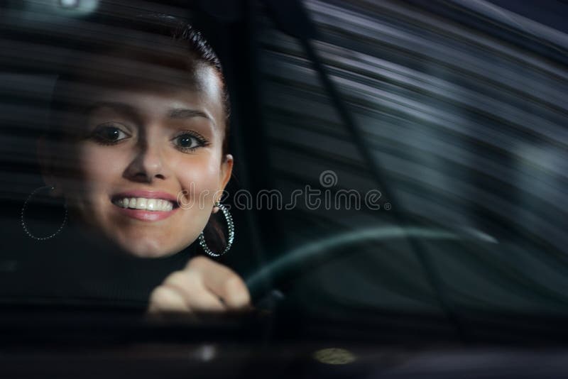 Young pretty woman driving car