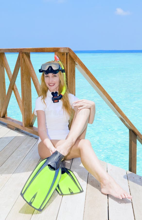Young pretty woman with flippers, mask and tube at royalty free stock photos Young pretty woman with flippers, mask and tube at royalty free stock photos