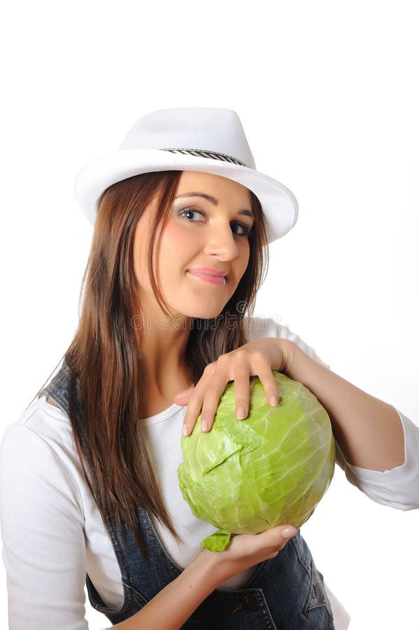 Young pretty woman with green cabbage