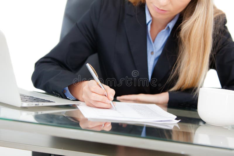 Young professional business woman working at desk