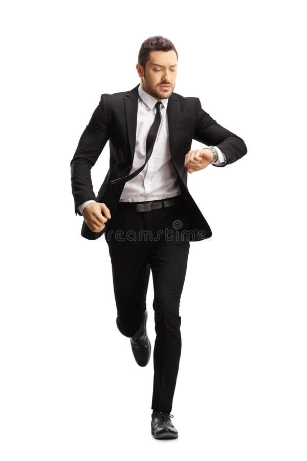 Young professional man in a suit running late