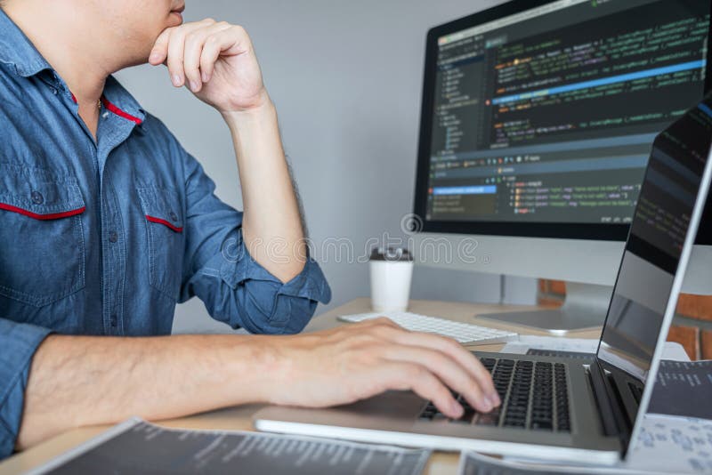Young Professional programmer working at developing programming and website working in a software develop company office, writing codes and typing data code, Programming with HTML, PHP and javascript. Developing programmer stock images, royalty-free photos and pictures