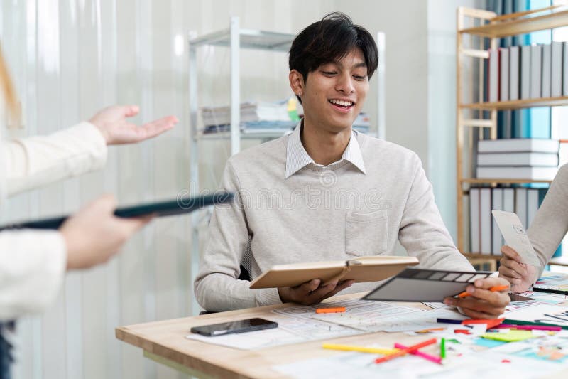 Young Professionals collaboration on UX UI Design Project in Modern Office Setting with Creative Tools and Digital stock photo