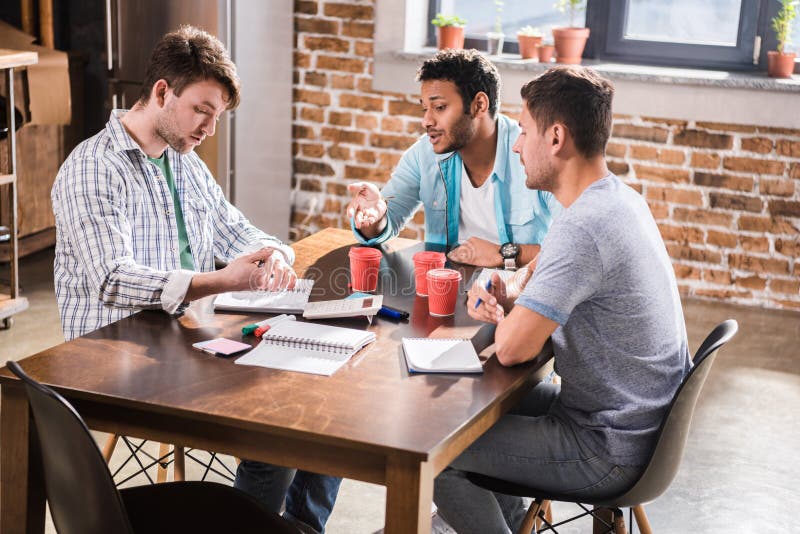 Young Professionals Working on Business Project Together Stock Photo