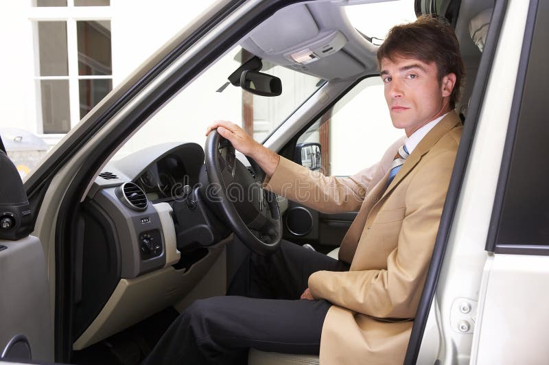 young proud executive test his new car on the road stock photos young proud executive test his new car on the road stock photos