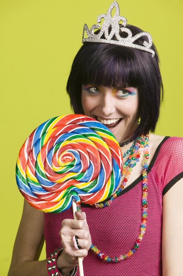 Young punk woman with a big lollipop