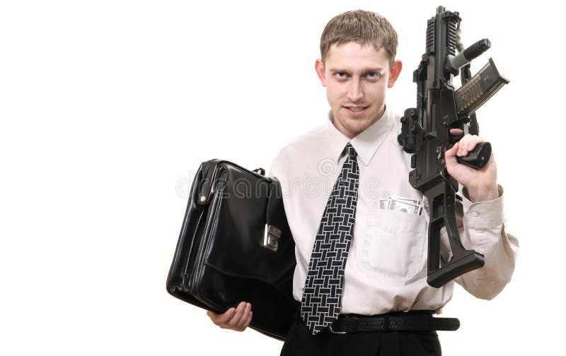 Young purposeful manager with gun