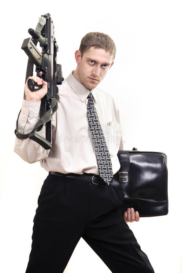 Young purposeful manager with gun