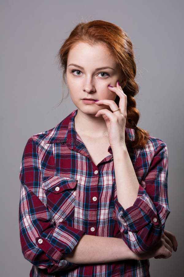 Young Red-haired Girl in a Plaid Shirt with Fingers on His Cheek Stock  Image - Image of business, attractive: 116257343