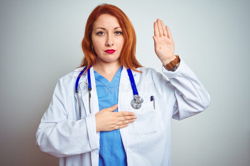 Young Redhead Doctor Woman Using Stethoscope Over White Isolated