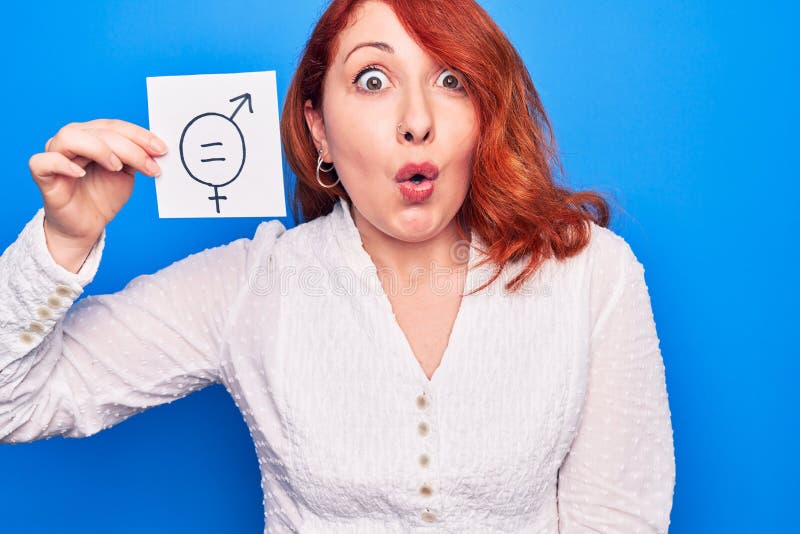 Young Redhead Woman Asking For Sex Discrimination Holding Paper With 