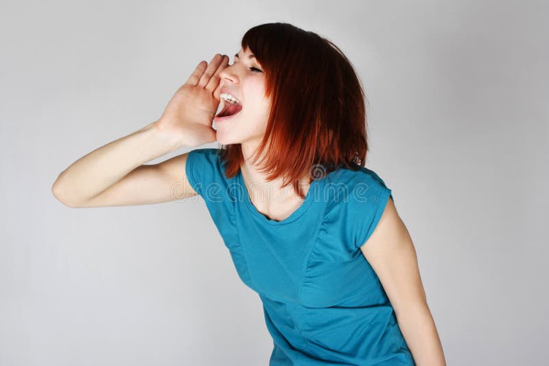 Young redhead woman calling someone