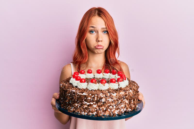 Young Redhead Woman Celebrating Birthday with Cake Depressed and Worry ...