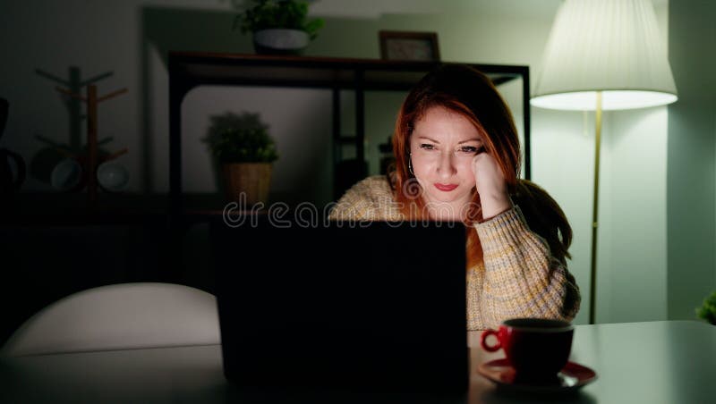 Young Redhead Woman Leaning On Table Sleeping At Home Stock Image