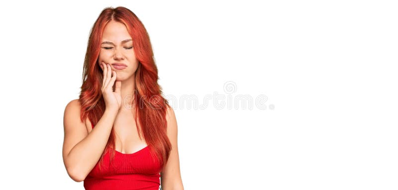 Young redhead woman wearing casual clothes touching mouth with hand with painful expression because of toothache or dental illness