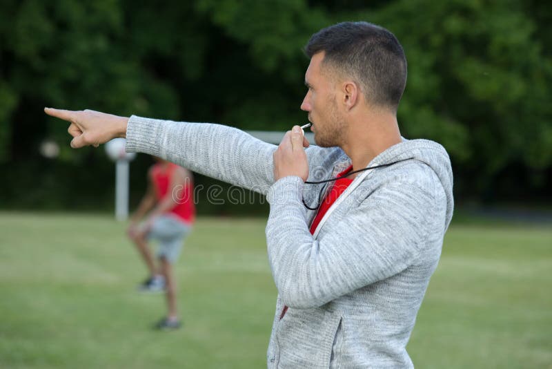 Young Referee Whistles on Football Field Stock Photo Image of