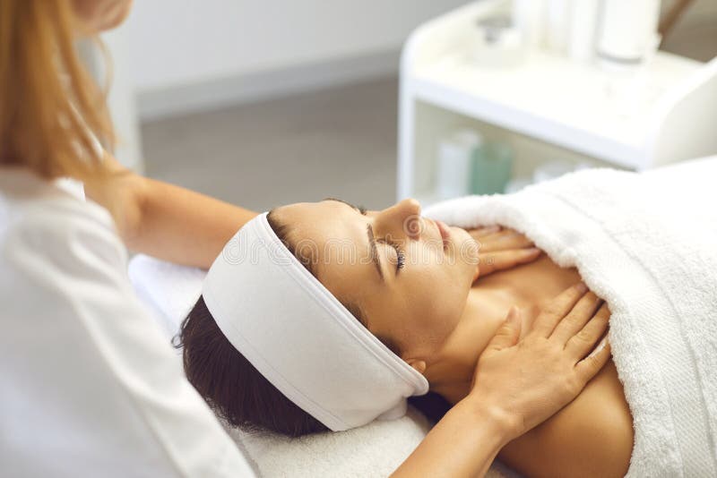 Woman Patient Getting Manual Relaxing Rejuvenating Massage For Face And