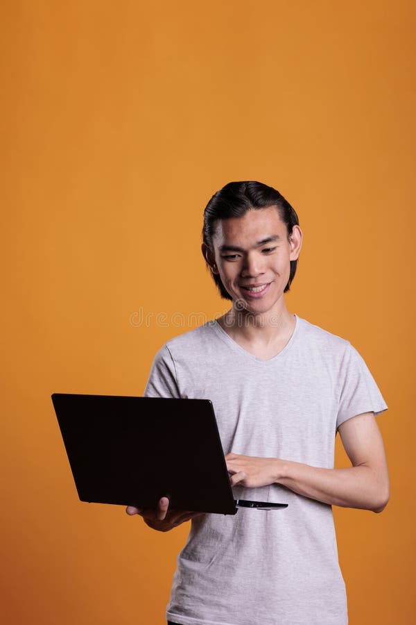 Young Remote Worker Working on Laptop Stock Photo Image of home, computer 258582708