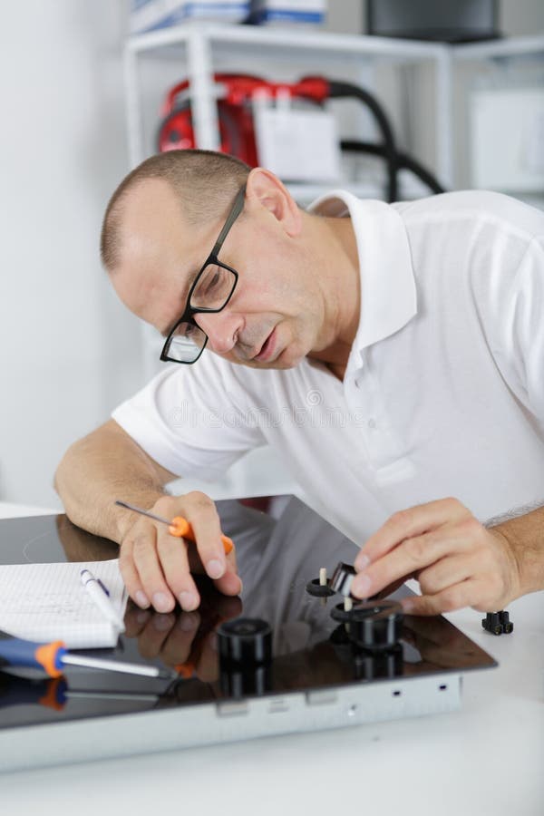 Young Repair Man Installing Kitchen Hobs Stock Image Image of people, electric 118387889