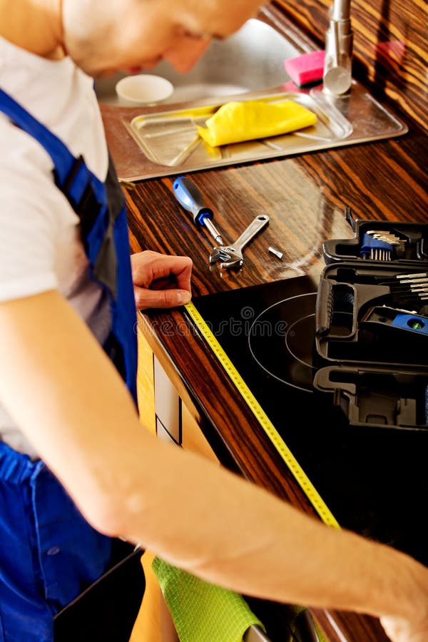 Young Repair Man Measuring Kitchen Stock Photo Image of