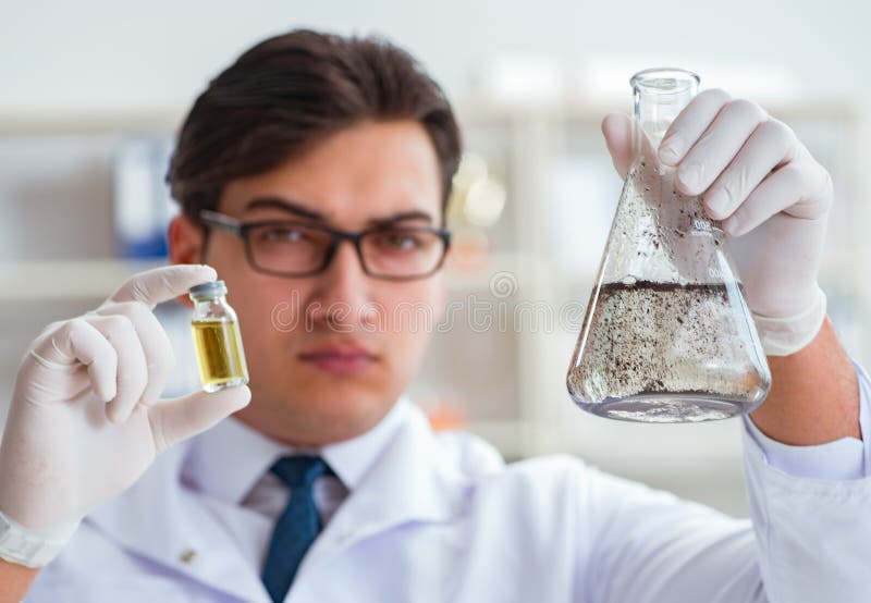 Young Researcher Scientist Doing a Water Test Contamination Expe Stock