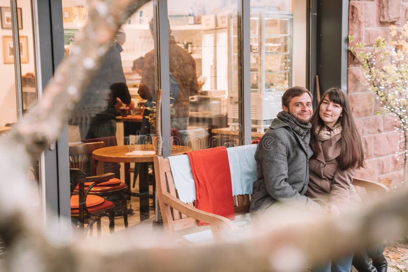 Young romantic couple sitting on the bench