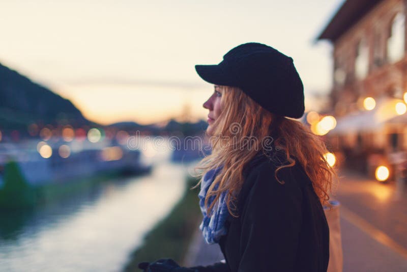 Young romantic woman daydreaming in city night stock photos Young romantic woman daydreaming in city night stock photos