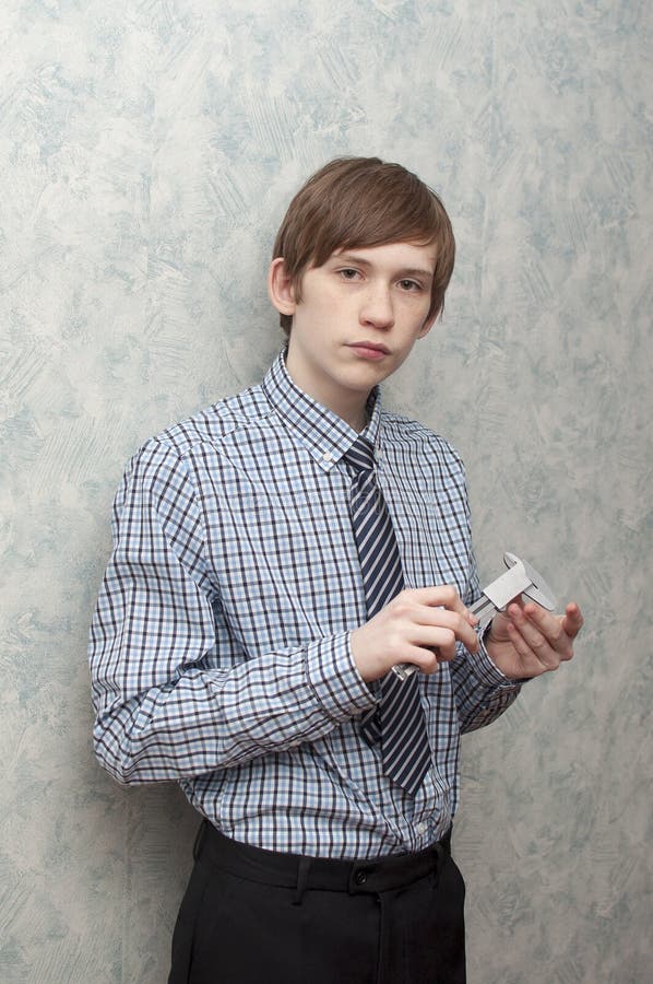 The Young Russian Guy Holds a Caliper in Hand Stock Image Image of