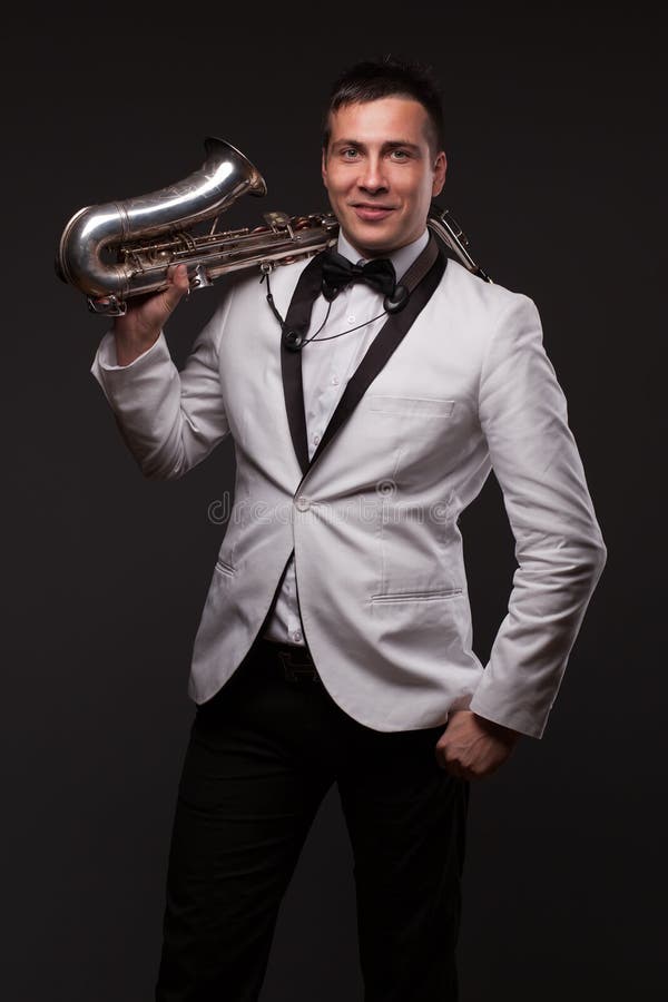 Saxophonist in tuxedo stock photo. Image of perform, concert 37943088