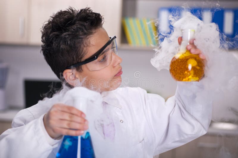 Little schoolboy working in chemistry lab. Little schoolboy working in chemistry lab