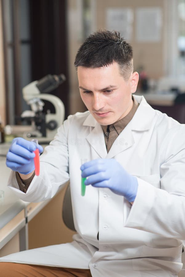 Young Scientist Working with Liquid Materials Stock Image - Image of