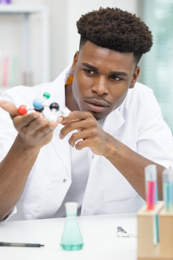 Young scientists studying dna models royalty free stock photos