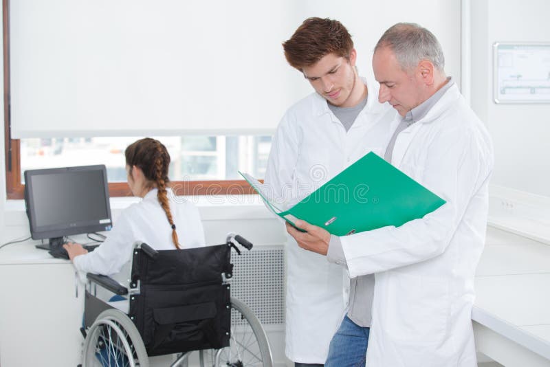 Young scientists working at laboratory stock photos Young scientists working at laboratory stock photos