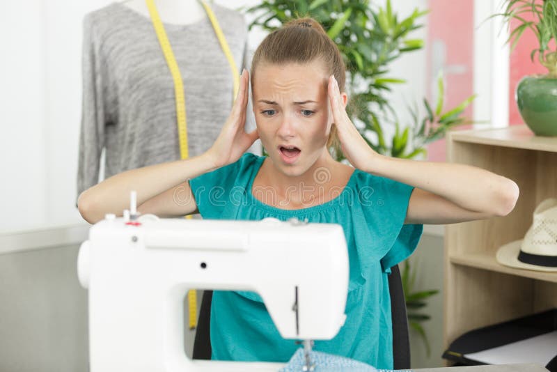 Young Seamstress Woman Having Difficulties with Sewing Machine Settings