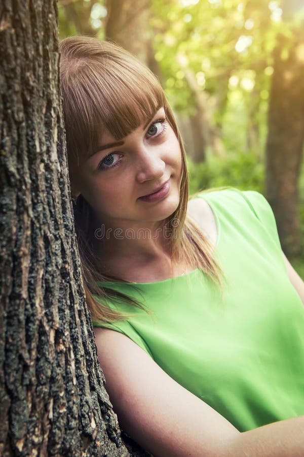 Young sensual girl leaning against a tree royalty free stock photos Young sensual girl leaning against a tree royalty free stock photos
